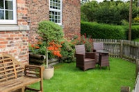 a wooden bench in a garden