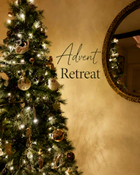 a christmas tree in front of a mirror with the words advent retreat