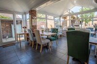 a dining room with tables and chairs