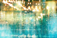 a blurry image of a pool with lights in it