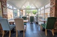 a dining room with tables and chairs