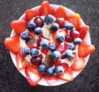 a bowl filled with fruit and berries